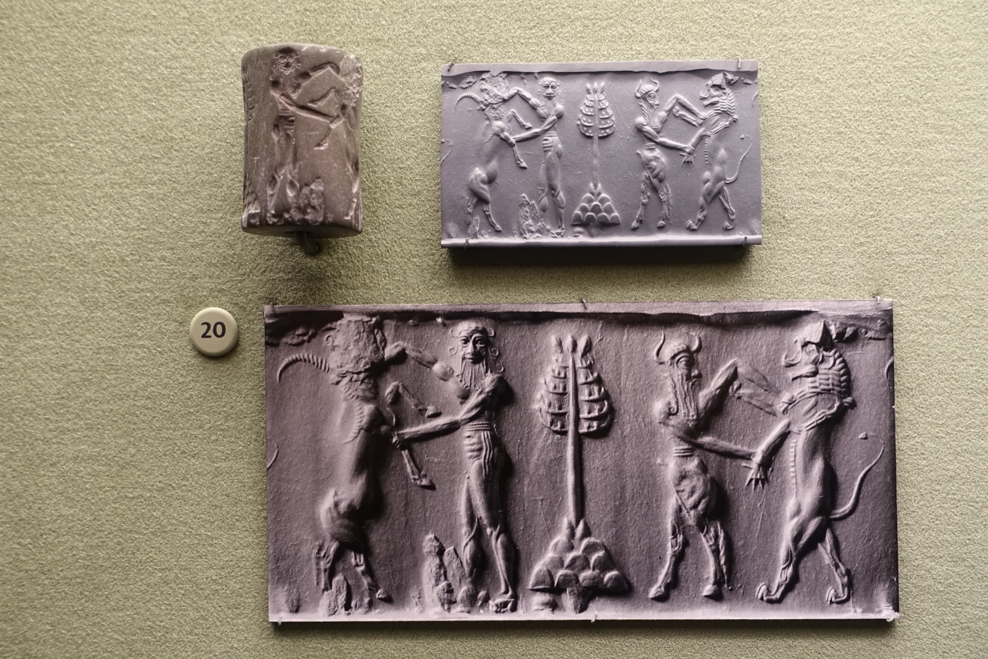 Akkadian cylinder seal impression, hero and bull-man wrestling beasts, Morgan Library