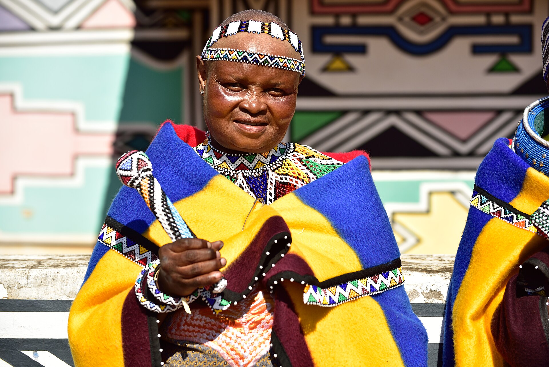 Ndebele dress and wall-painting — geometry as inheritance.