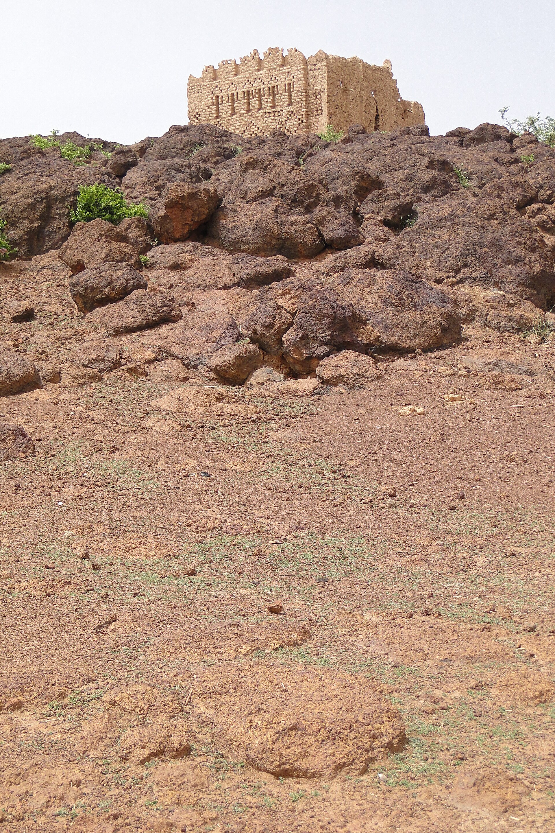 A Sahelian mud mosque — the day shaped around prayer.
